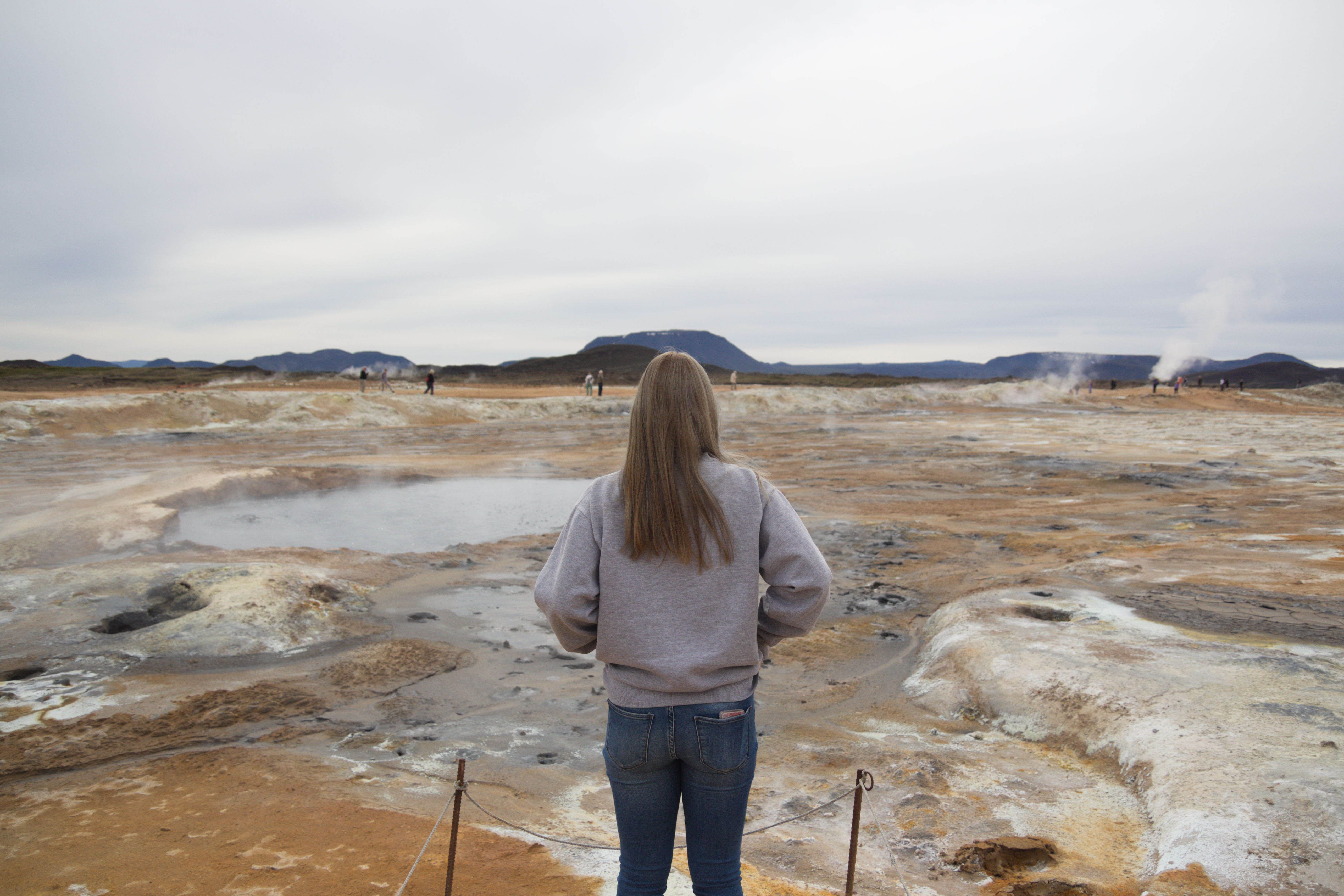 img of woman looking across the sulfur fields of iceland